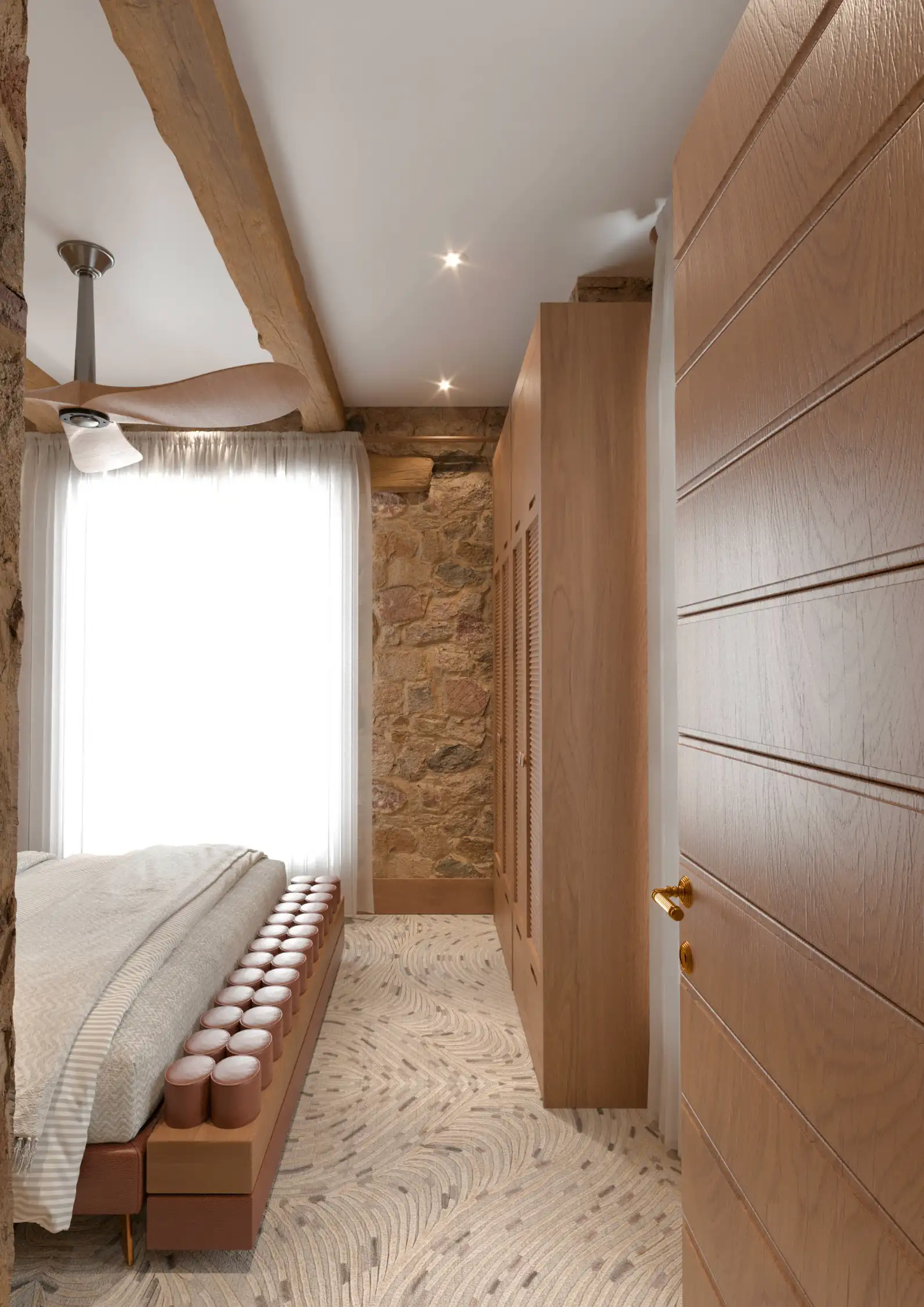 Minimalist luxury kitchenette with marble backsplash in a rustic stone structure.