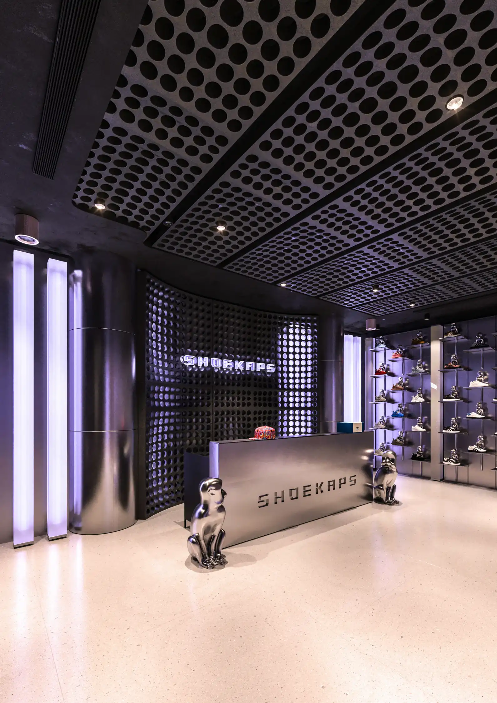 Infinite reflection sneaker archive wall using stainless steel panels